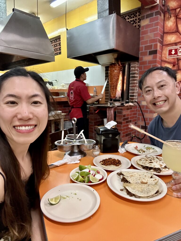 Delicious al pastor tacos with pineapple and salsa on warm corn tortillas – must-try in your Mexico itinerary