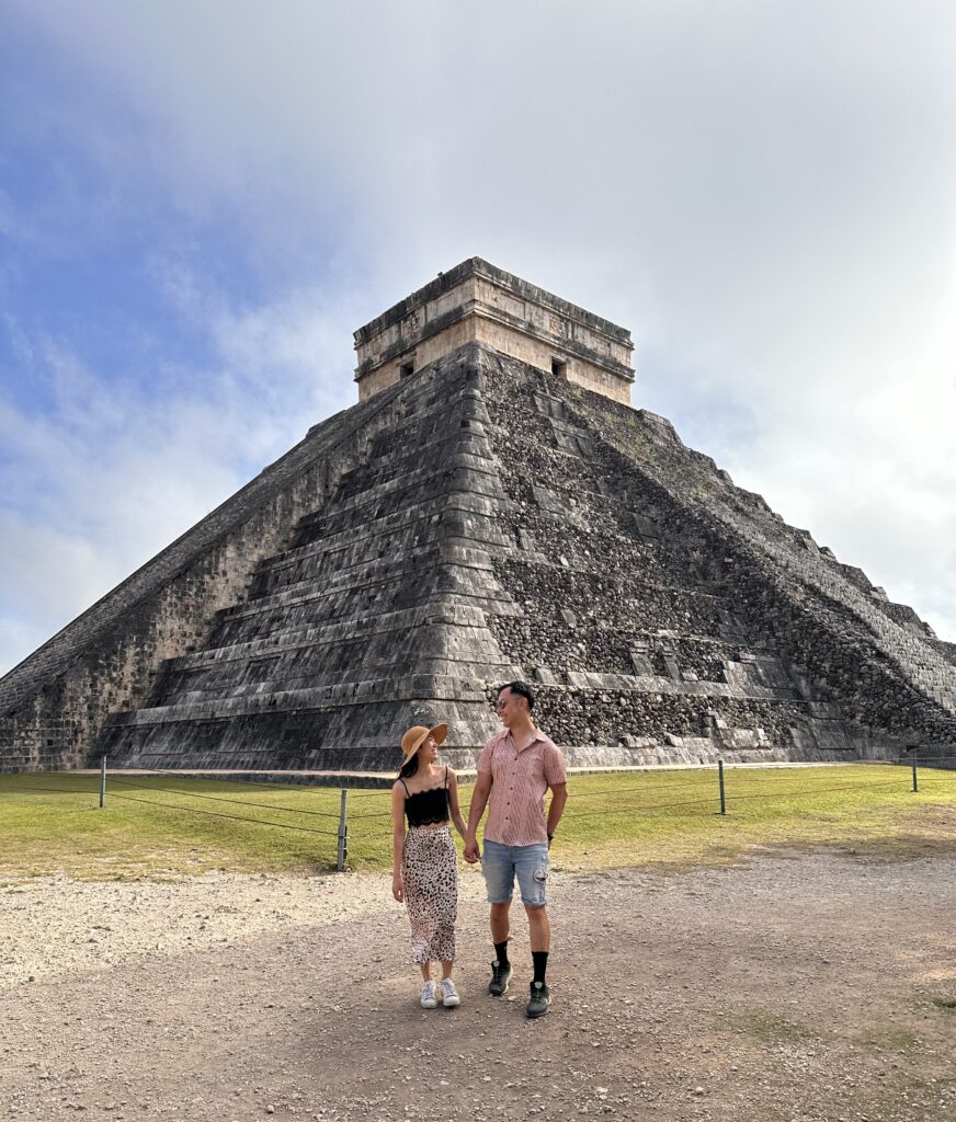 Us having fun at Chichen Itza in front of El Castillo, one of the best highlights of our 2 week Mexico itinerary
