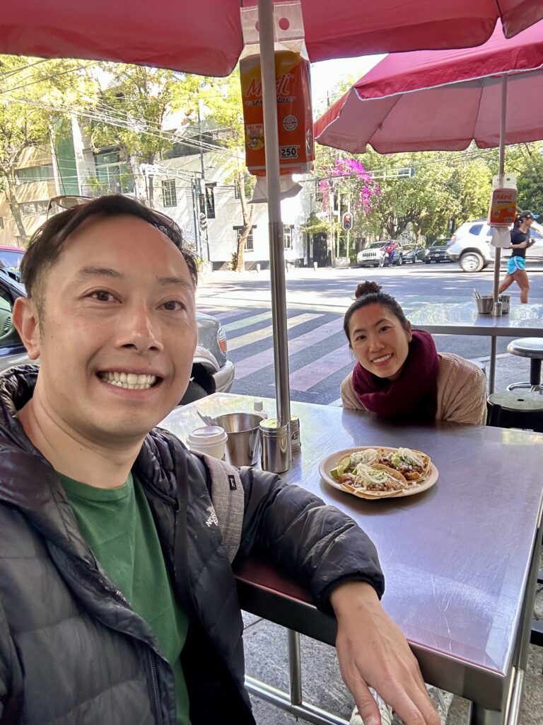 Juicy pork rib and crispy pork belly tacos served on warm tortillas, nestled in the lush, tree-lined streets of Condesa, Mexico City – a must-try local favorite!