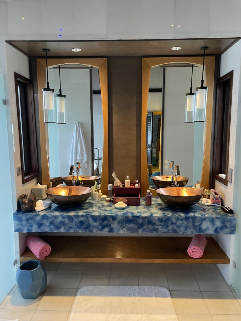 Indulge in a luxurious bathroom experience with twin vanity wash basins inside the Wind Villa at Ozen Life Maadhoo, designed for ultimate convenience and elegance.