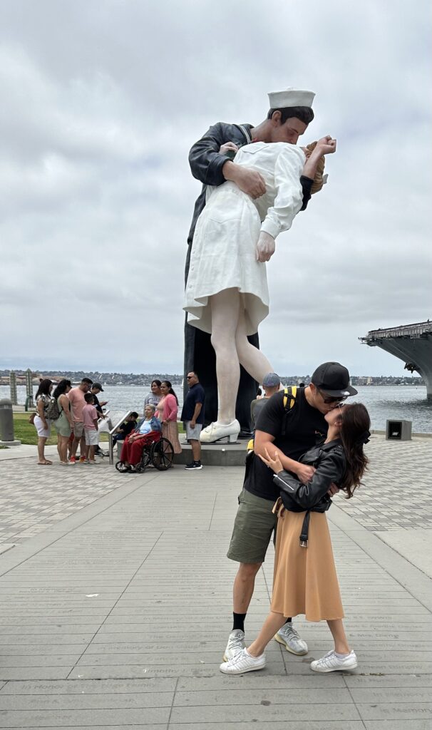 Iconic Unconditional Surrender statue of a sailor kissing a nurse near the USS Midway Museum in San Diego