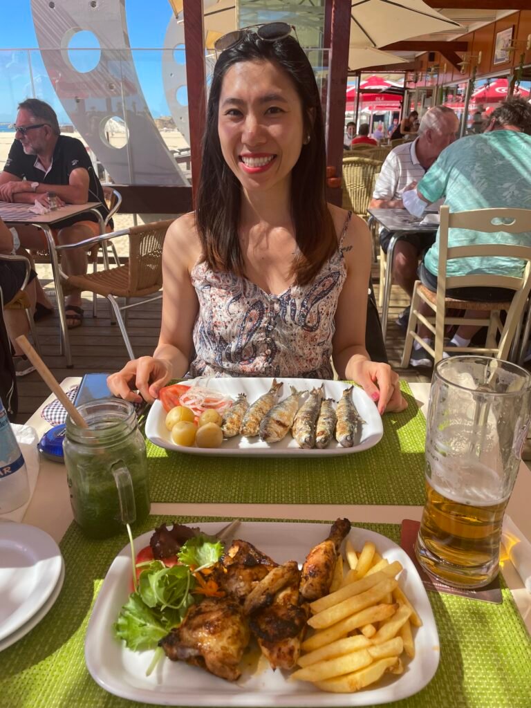 Casual lunch of sardines and salad with the sound of waves in the background