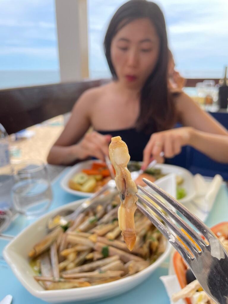 Grilled razor clams served at a beachside restaurant in the Algarve
