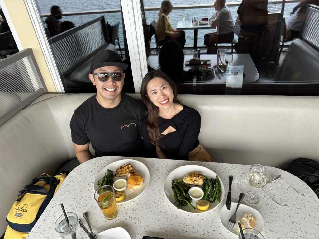 Seafood lover enjoying a fresh grilled seafood with a view of San Diego bay