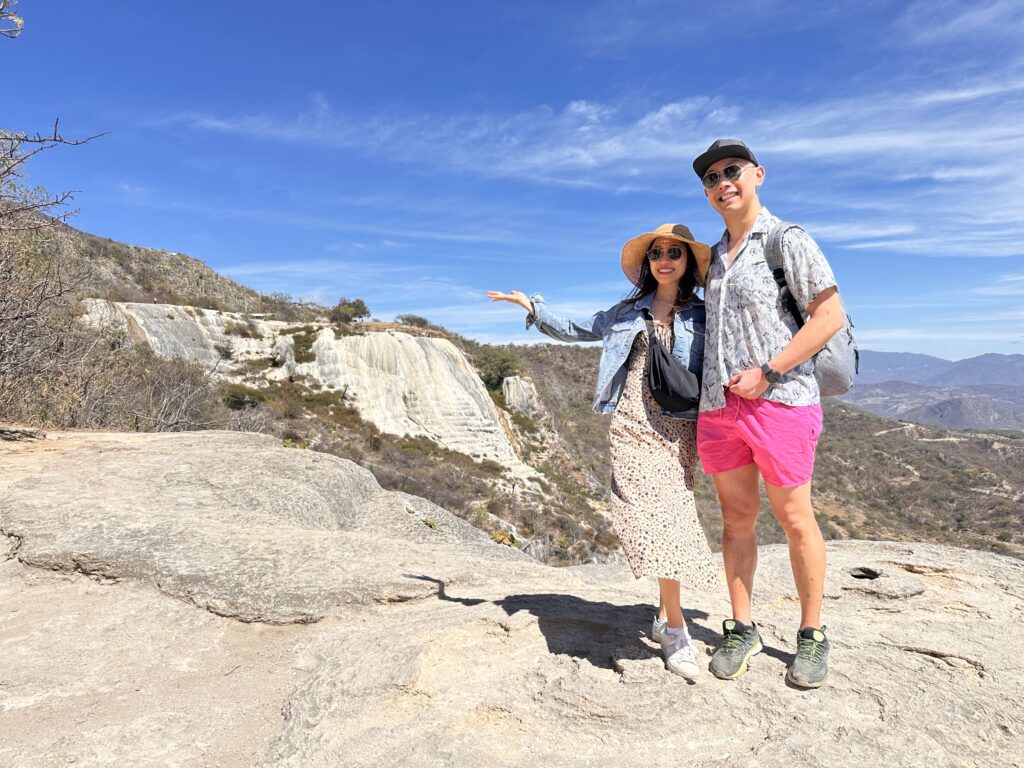 Us standing in front of the stunning Hierve el Agua petrified waterfalls, a natural wonder in Oaxaca, Mexico