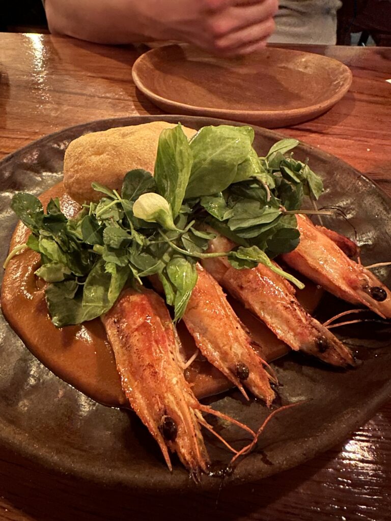 Indulge in a one-of-a-kind guava mole and shrimp dish at Levadura de Olla, combining tropical sweetness and savory flavours