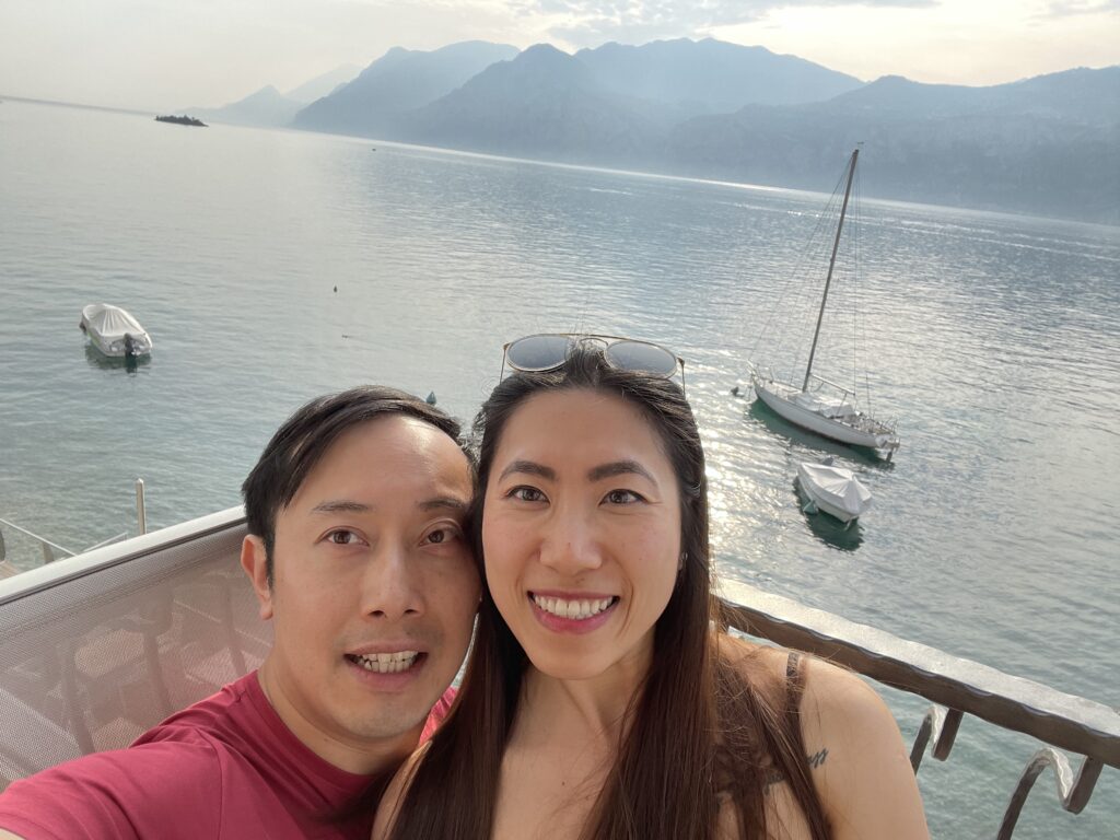 Relaxing on balcony at Hotel Venezia with scenic Lake Garda in the background