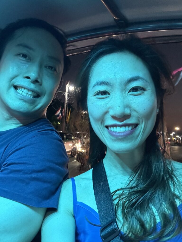 Taking a traditional tuk tuk ride through Bangkok’s bustling streets, weaving between traffic while enjoying the sights of the city. One of the top things to do in Bangkok!