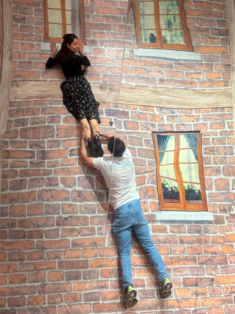 Guests exploring the Museum of Illusions in Lyon, engaging with a variety of 3D interactive exhibits designed to challenge perceptions and surprise the senses.
