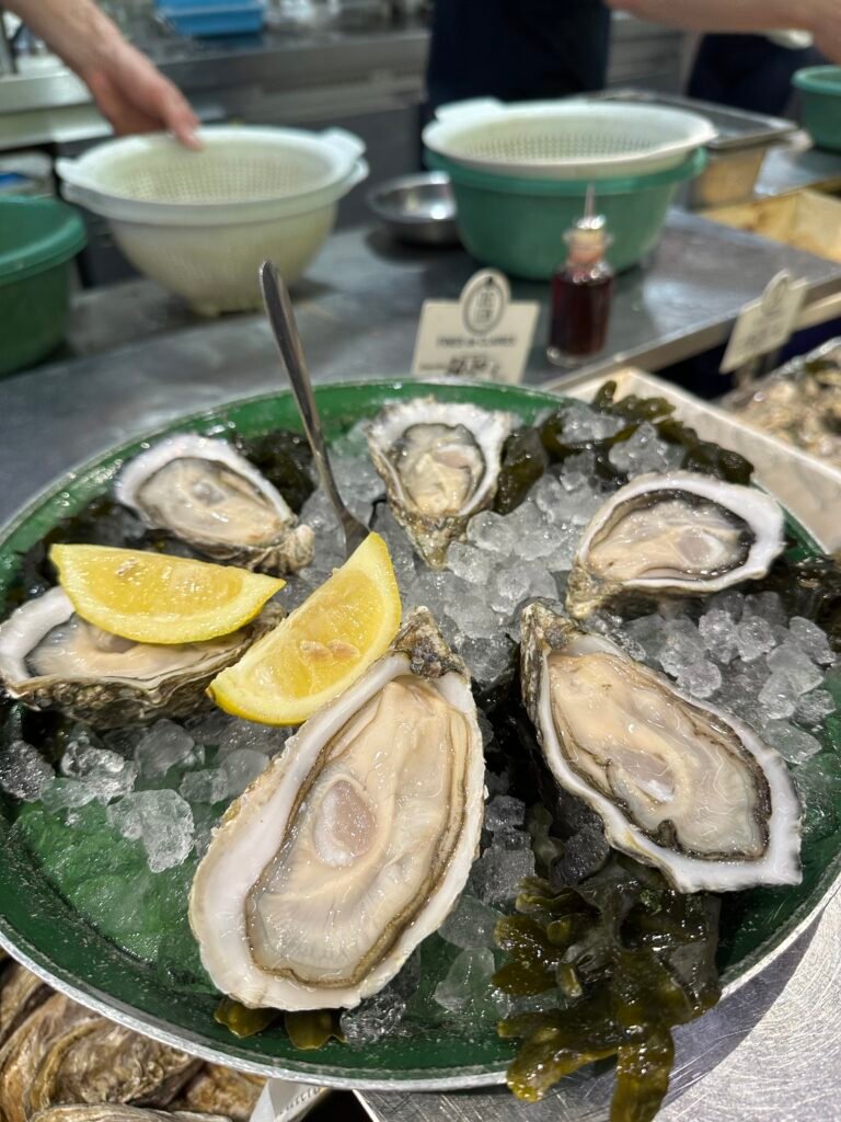 Fresh oysters on ice at Les Halles de Lyon – Paul Bocuse, a gourmet food market in Lyon