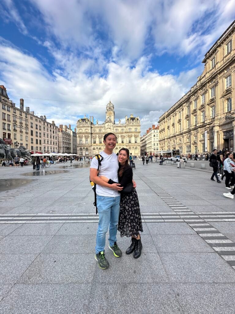 Beautiful historic buildings surrounding Place des Terreaux in Lyon, showcasing classical French architecture and the grandeur of the city square.