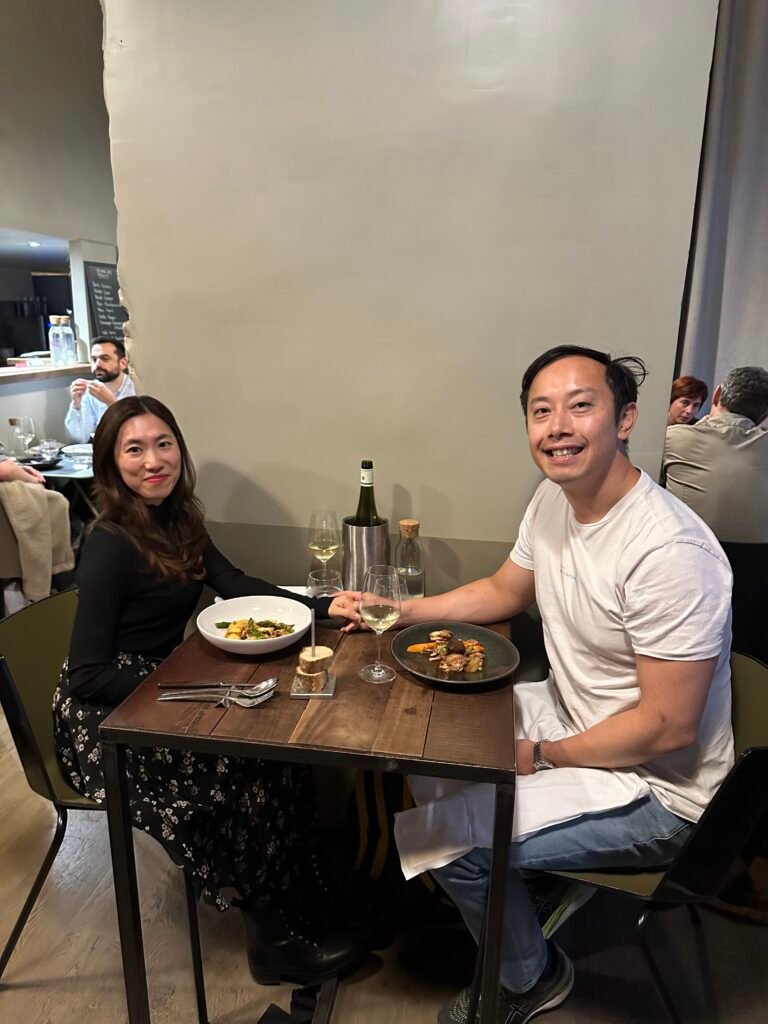 Couple enjoying a multi-course tasting menu at Aromatic, a contemporary bistro in Lyon