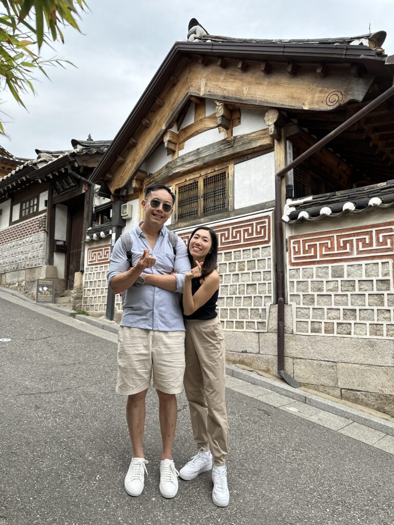 A peaceful street in Bukchon Hanok Village showcasing historic Korean houses and stone pathways