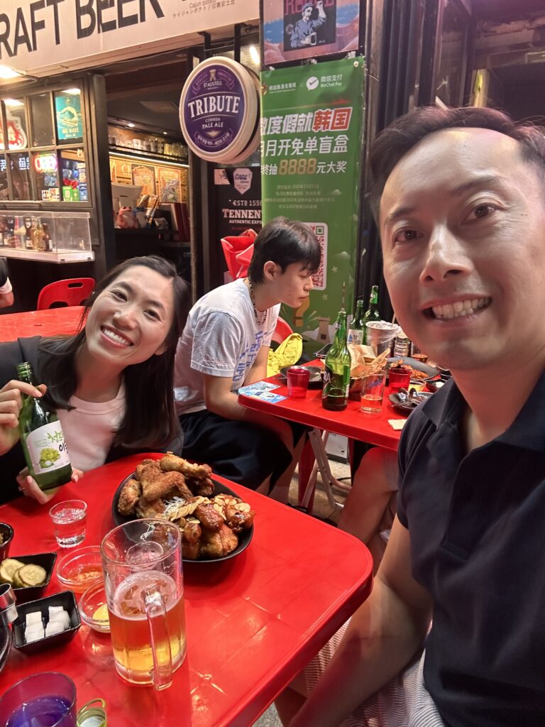 Enjoying traditional Korean fried chicken and soju in the vibrant atmosphere of Oppadak, Seoul