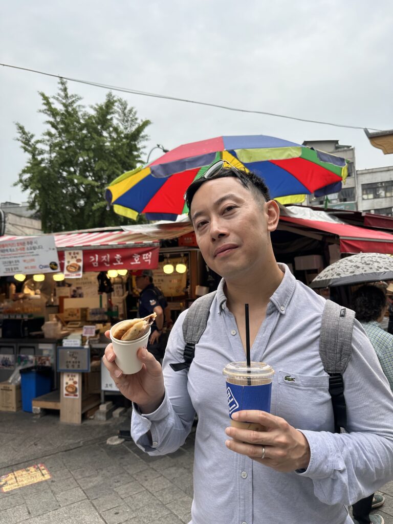 A sweet hotteok paired with a glass of iced coffee, perfect for a Korean street snack break