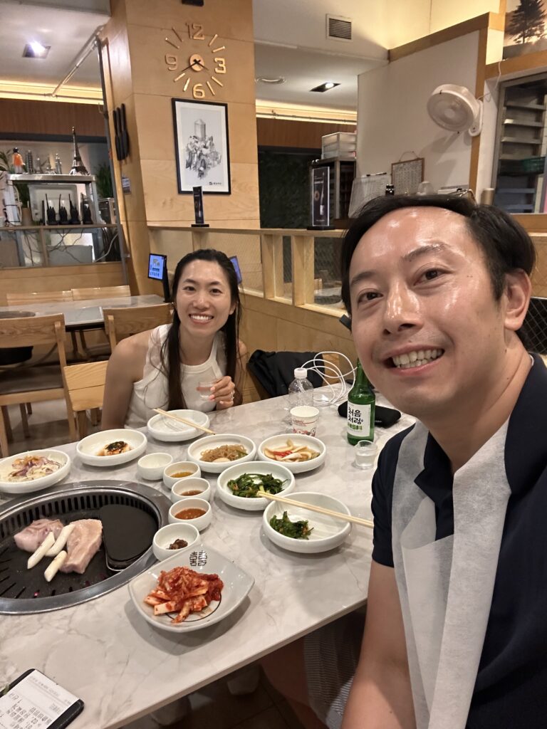 Couple happily enjoying Korean BBQ over and over again while traveling in South Korea