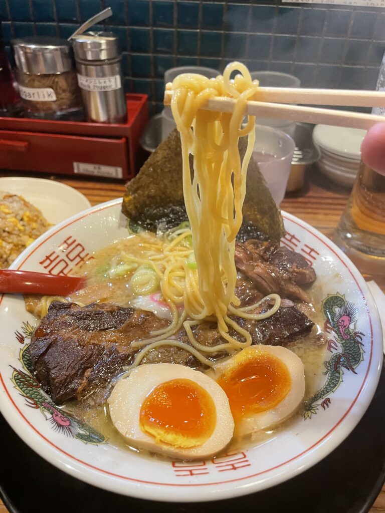 Hanamaruken Hozenji’s signature pork rib ramen, with slow-cooked ribs, rich broth, noodles, and garnishes.
