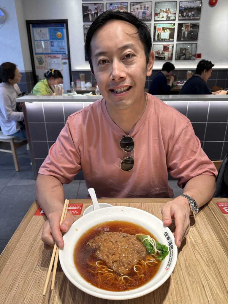 Traditional Chinese noodle shop in Shanghai preparing fresh bowls of stir-fried noodles