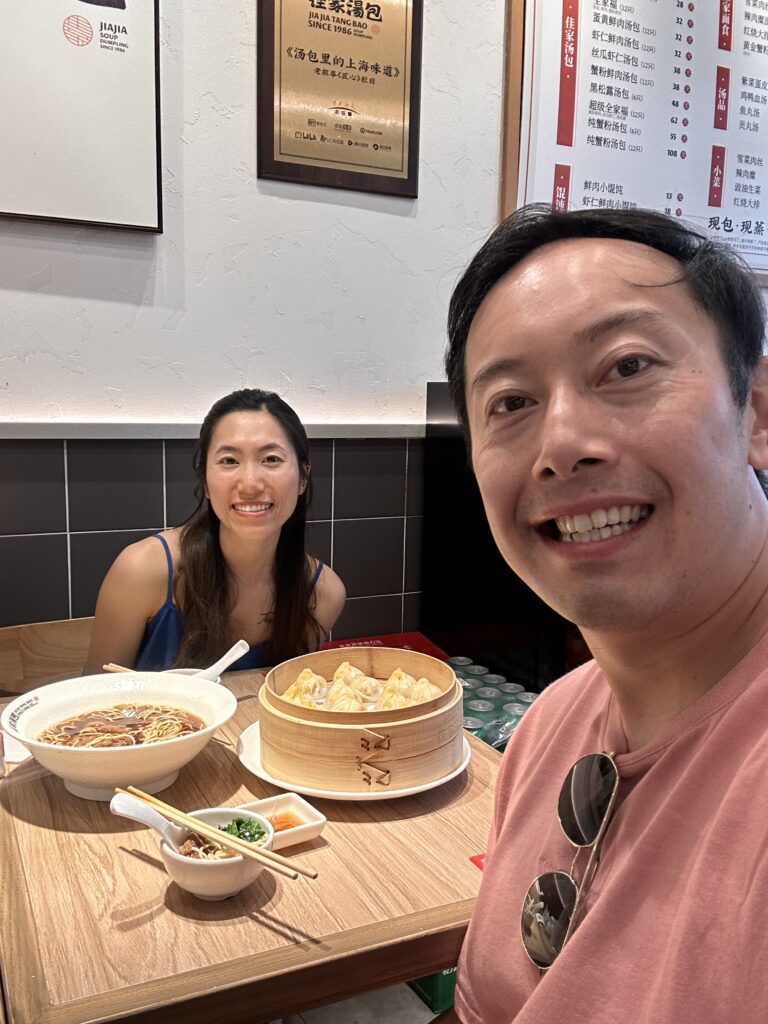 Diners enjoying hot xiaolongbao at Jia Jia Tang Bao, a popular Shanghai soup dumpling eatery