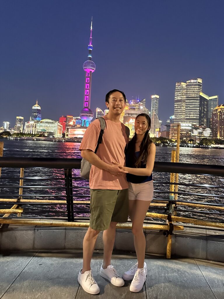 Visitors taking photos along The Bund waterfront with Shanghaiâs futuristic skyline in the background