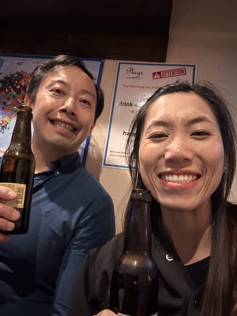 Couple enjoying the vibrant tiny bars in Golden Gai Tokyo experiences