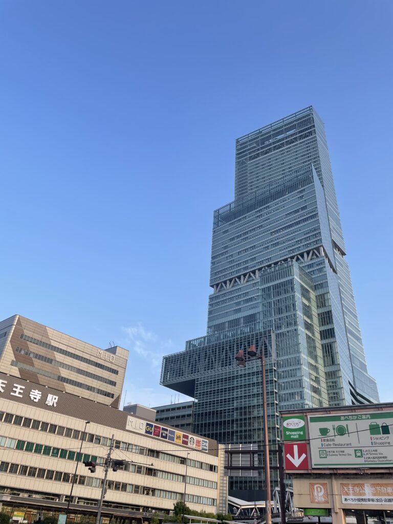 Abeno Harukas, a shimmering glass skyscraper in Osaka, soaring 300 meters with a sleek, minimalist design