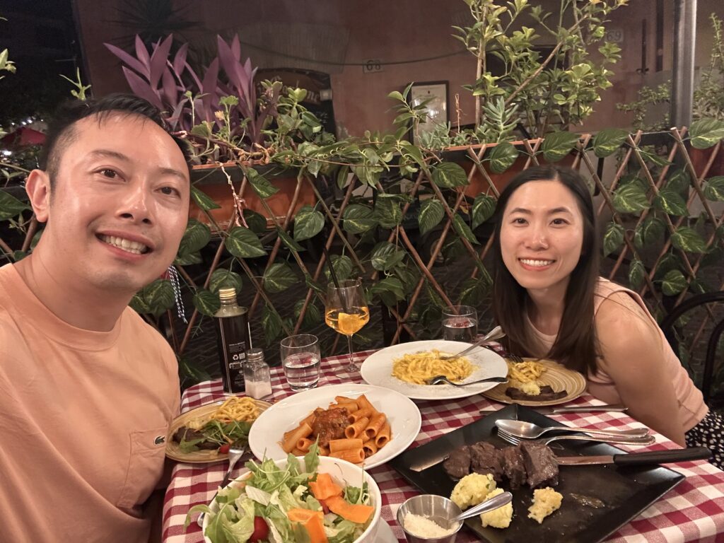 Evening dining at Antico Carbone with lanterns and cozy street atmosphere.