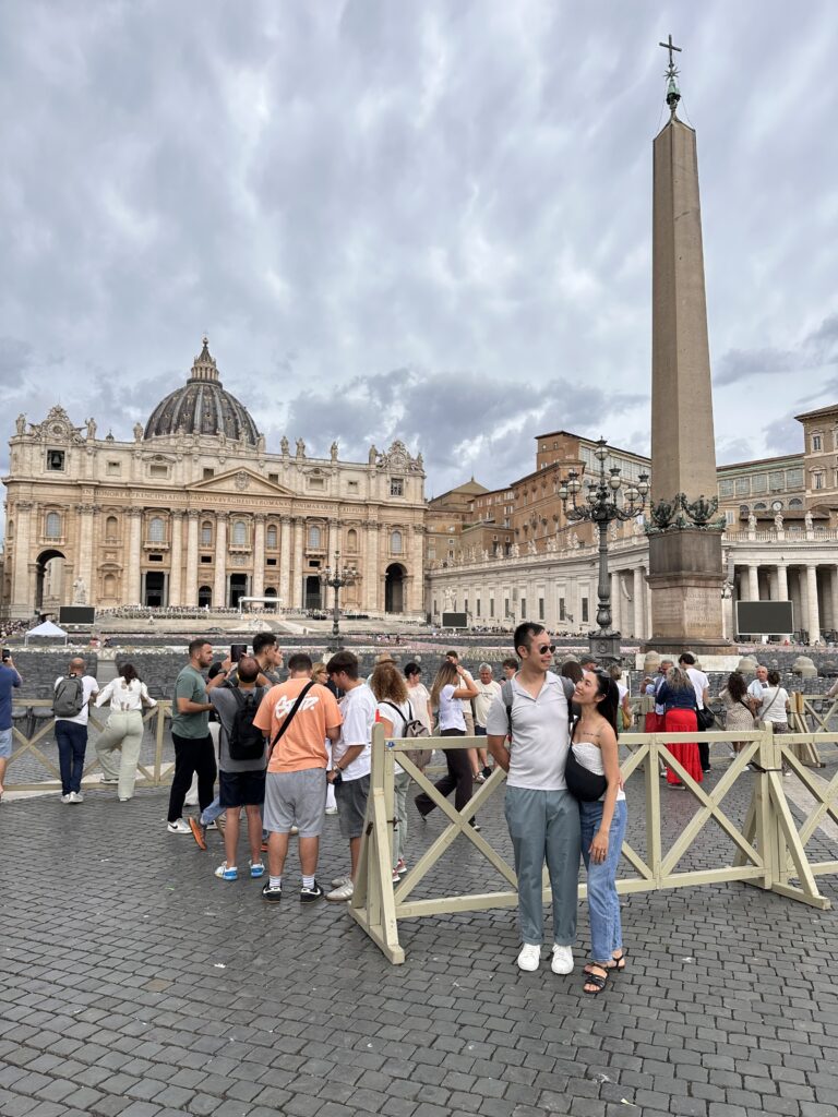 St. Peter’s Basilica exterior with grand dome rising above St. Peter’s Square in Vatican City.