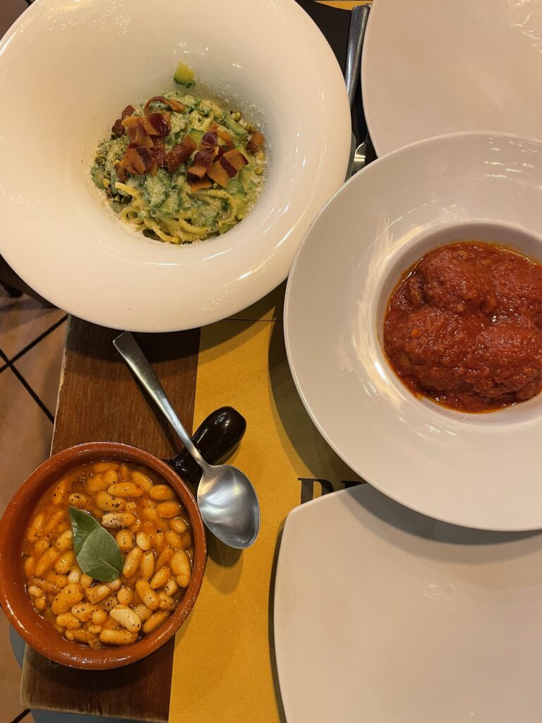 Plates of Italian cuisine served at Rione IV Bistrot’s intimate dining tables.