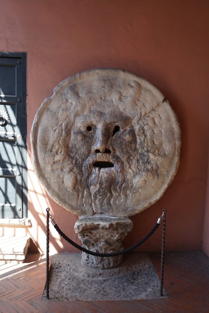 Ancient marble face known as the Mouth of Truth in Rome, Italy.