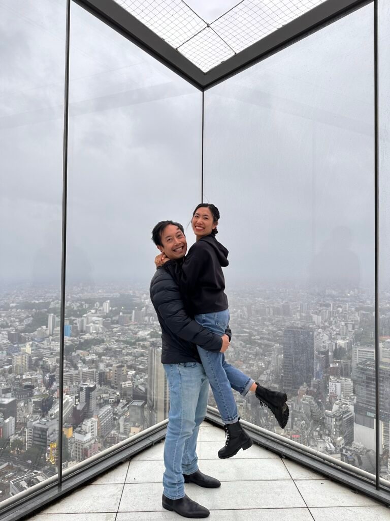 Couple enjoying the views at Shibuya Sky, Tokyo, Japan